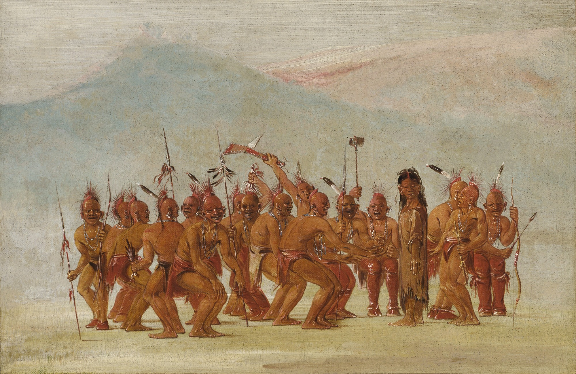 A 19th-century painting showing a ceremonial dance in a Plains village. At the center, a Two-Spirit dancer stands with arms raised and slightly bent, wearing a long decorated garment, animal-hide accessories, and feathered ornaments. Several men sit in a semicircle behind the dancer, beating drums and singing, while others watch from the sides. Tipis and a blue sky form the background. The dancer’s posture is dynamic and expressive, emphasizing movement, fluidity, and ceremonial significance